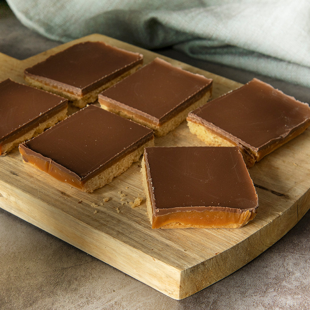 Bryson's Millionaire Shortbread Slices on a chopping board.